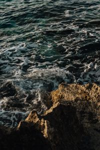Kaboompics - Sea Water and Dark Rocks in Coastal Light
