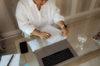 Kaboompics - Black Woman Planning Notes at Home Workspace