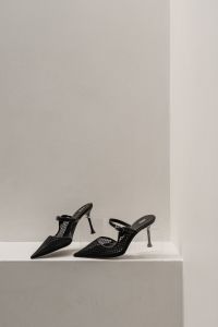 Kaboompics - Black Woven Slingback Heels on Display Shelf