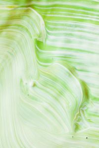 Kaboompics - Vertical Pastel Green Marbling with Soft Flowing Lines for Modern Backgrounds