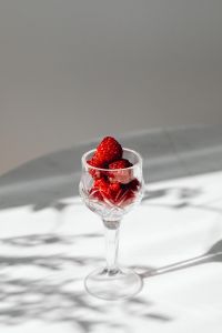 Kaboompics - Raspberry Filled Stemmed Glass On Marble