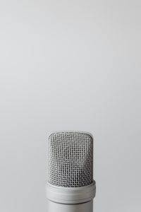 Kaboompics - Minimal Silver Microphone on Gray Background with Copy Space for ASMR Audio