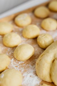 Kaboompics - Floured Paczki Dough Rounds Ready for Cherry Filling
