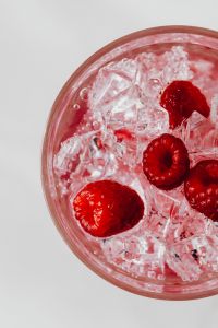 Kaboompics - Close Up Raspberries In Ice Filled Glass