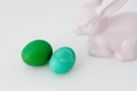 Kaboompics - Green Easter Eggs on Checked Linen Beside a White Ceramic Bunny