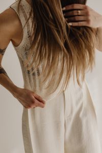 Kaboompics - Textured Knit Top with White Trousers