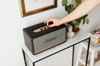 Kaboompics - Black speaker on marble table, white wall, sculpture, hand,  painting