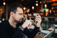 Kaboompics - Young man using mobile phone