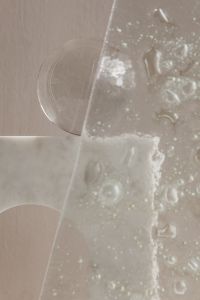 Kaboompics - Glass Sphere Framed by Ribbed Glass Panel