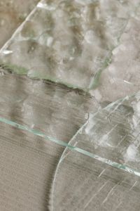 Kaboompics - Layered Glass Panel Edges over Neutral Ribbed Background