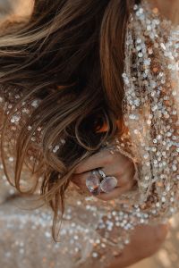 Kaboompics - Statement Rings and Sequin Dress Close Up