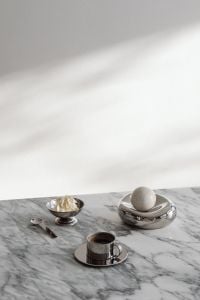 Kaboompics - Chrome Coffee Cup, Silver Cream Bowl and White Sphere on Veined Marble, Metallic Still Life