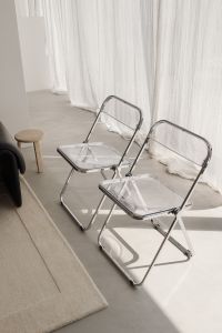 Kaboompics - Black Sofa and Chrome Chairs in Warm Minimalist Interior