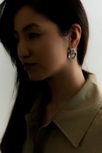 Kaboompics - Moody Portrait of Woman Wearing Silver Earrings