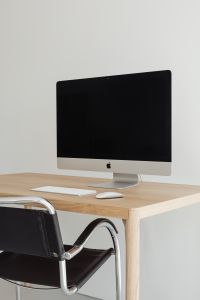 Kaboompics - Vertical Apple Computer Workstation with Oak Desk and Black Leather Chair