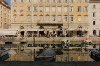 Kaboompics - Trieste Grand Canal with Moored Boats and Historic Waterfront Buildings
