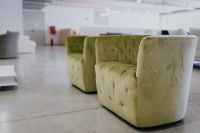 Kaboompics - Olive Green Velvet Armchair with Pale Upholstered Arms and Black Metal Legs