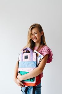 Kaboompics - Smiling Student Holding School Backpack