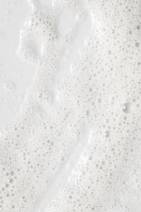 Kaboompics - White Cleanser Foam with Fine Micro Bubbles, High-Key Skincare Texture Macro