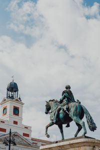 Kaboompics - Madrid Equestrian Monument and Clock Tower Beneath Dramatic Cloudscape