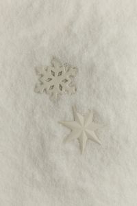 Kaboompics - Perfume Bottle Covered in Artificial Snow