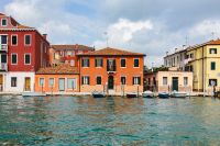 Kaboompics - Red, Orange and Yellow Canal-Side Houses across the Water in Murano, Italy
