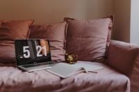Kaboompics - Laptop, Open Planner and Coffee Against Pink Cushions
