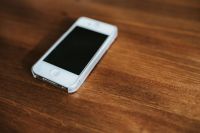 Kaboompics - White smartphone on a table