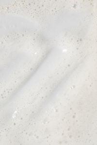 Kaboompics - Vertical White Foam Background with a Top Band of Clear Bubbles and Soft Lather