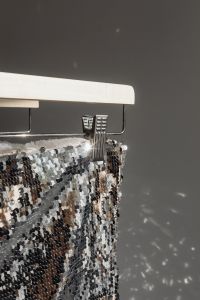 Kaboompics - Close-Up Silver Sequin Clothing Detail on Hanger