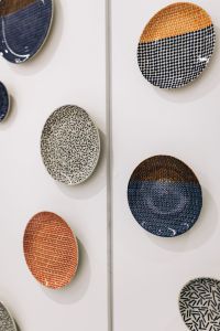Kaboompics - Colorful Patterned Ceramic Plates on White Display Wall