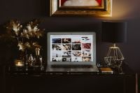 Kaboompics - Elegant Home Office Interior with Laptop, Framed Art and Gold Lamps