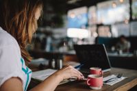Kaboompics - Young woman working in a cafe
