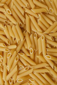 Kaboompics - Overhead Penne Pasta Pieces, Vertical Texture for Food Photography