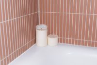 Kaboompics - White Candles on Bathtub in Pink Tiled Bathroom