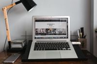 Kaboompics - Front view of laptop and mobile phone on the wooden desk