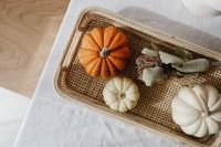 Kaboompics - Wicker Tray with Orange and White Pumpkins Viewed from Above