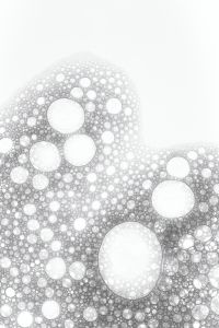 Kaboompics - Diagonal Trail of White Foam Bubbles with Wide Copy Space, Vertical Abstract Background