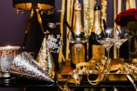 Kaboompics - Silver Party Horn, Gold Cone Hats and Champagne New Year's Eve Still Life