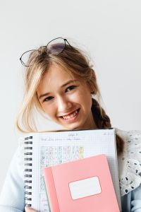 Kaboompics - Schoolgirl Holding Books for Back to School