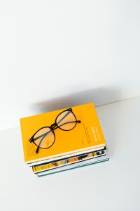 Kaboompics - Portrait Yellow Book with Glasses near the Lower Edge