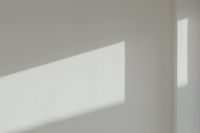 Kaboompics - Minimalist White Wall Wallpaper with Sunlit Shadow