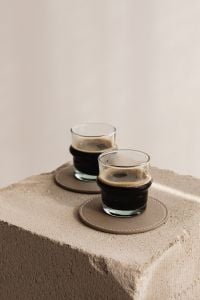 Kaboompics - Minimal Coffee Glasses on a Stone Plinth Against a Beige Wall