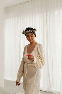 Kaboompics - Bride Wearing a Floral Crown and Holding a Pink Drink