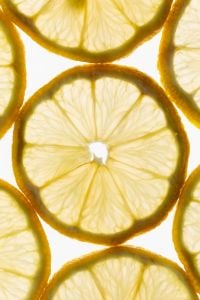 Kaboompics - Close-Up Lemon Slices on White Background