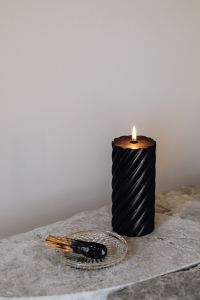 Kaboompics - Black Candle and Palo Santo on Marble Tray with Negative Space, Neutral Background