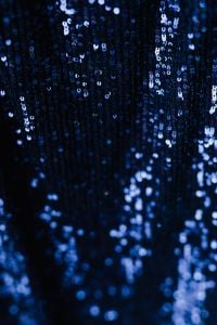 Kaboompics - Deep Blue Sequin Fabric Draped in Soft Folds, Sparkling Textile Background