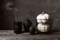 Kaboompics - Black Halloween Candle and White Pumpkins in Wire Basket