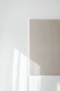 Kaboompics - Sunbeam on a Blank White Wall and Beige Canvas
