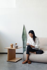 Kaboompics - Woman Writing in a Notebook in a Japandi Interior